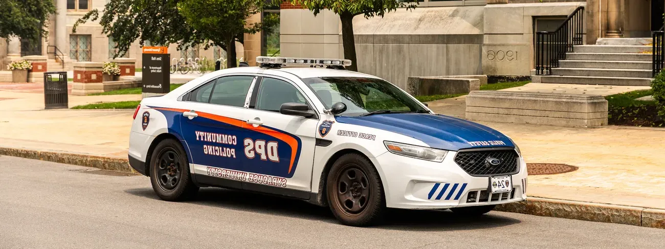 A Department of Public Safety vehicle outside of a building.